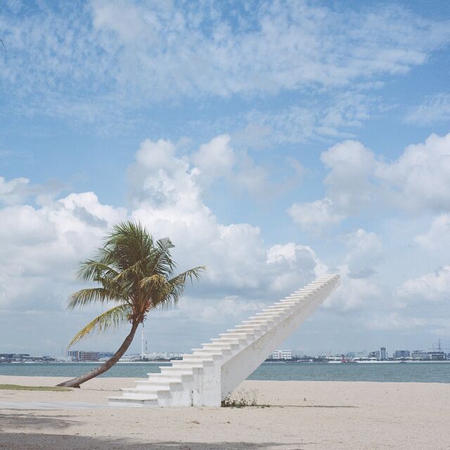 A beachfront sculpture of a stairway going nowhere in Forest City