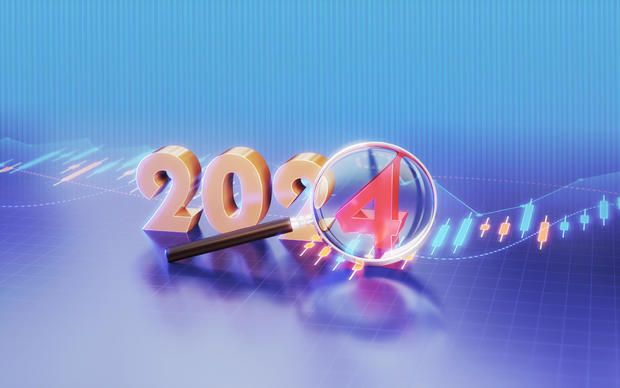 New Year 2024 Sitting on Table with Business and Financial and Technical Data Marked with Magnifying Glass 