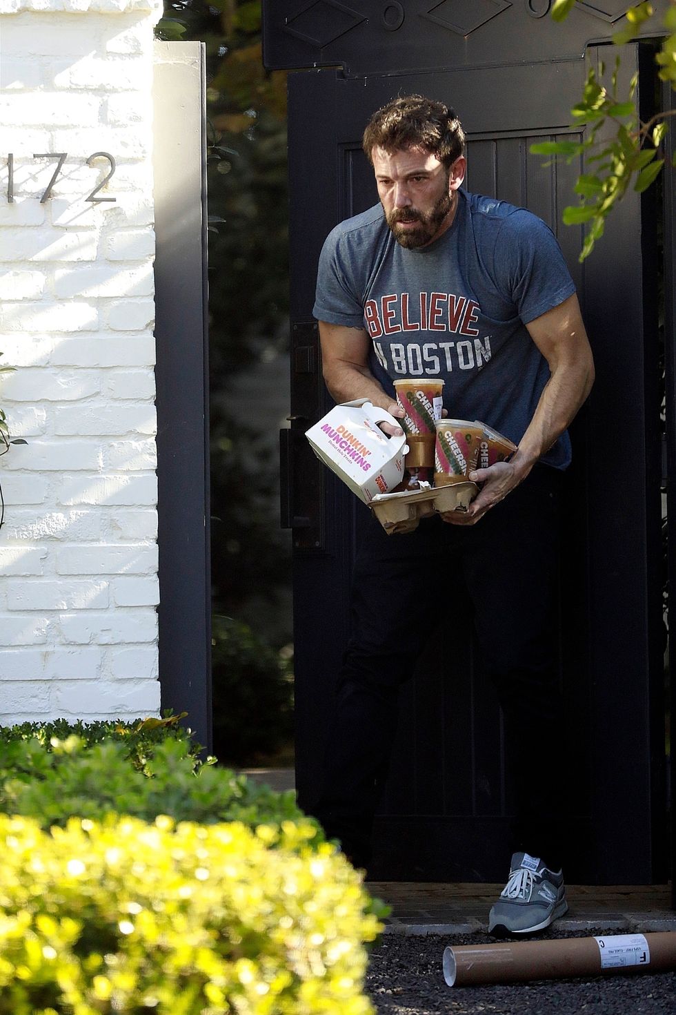 a man holding a box of candy