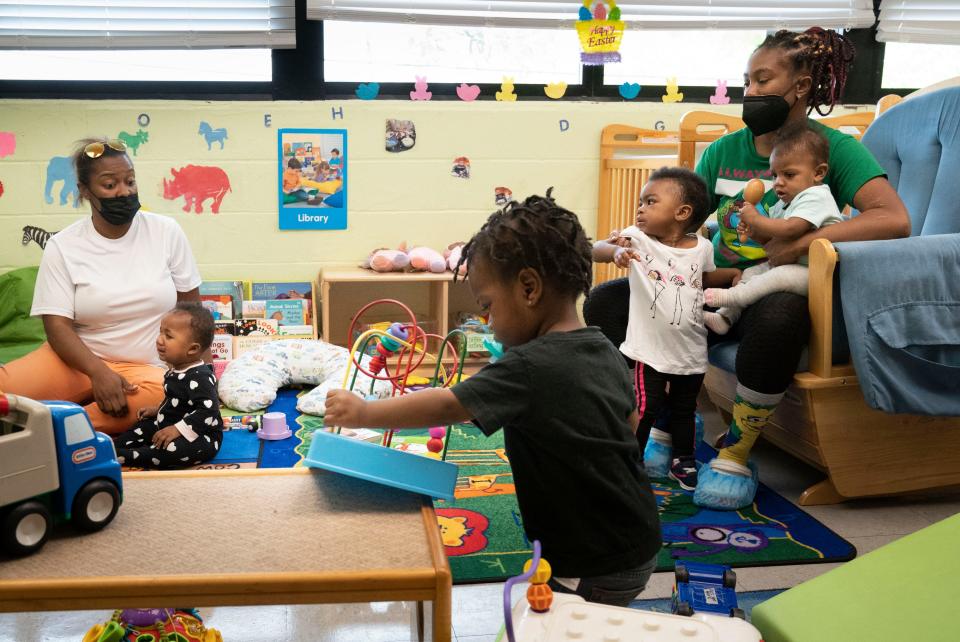 Latasha Watkins and Tiffany Gooch care for toddlers at Eighteenth Avenue Family Enrichment Center Thursday, April 21, 2022, in Nashville, Tenn.